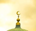 Islamic symbol on mosque cupola on yellow cloudy background